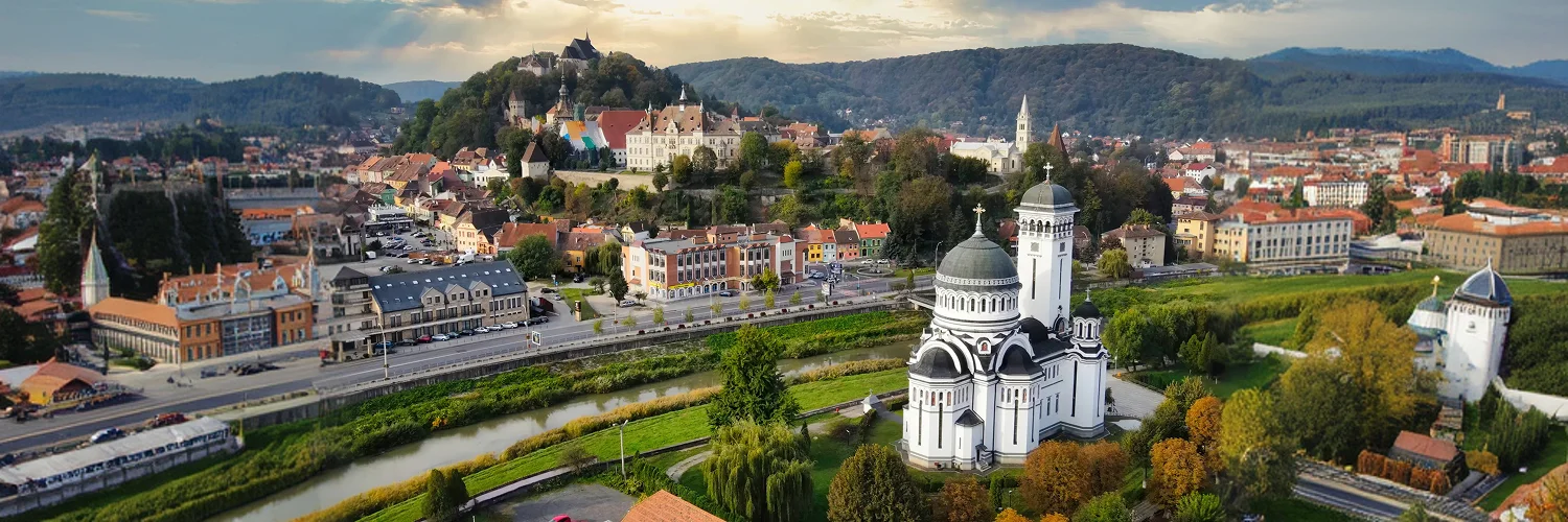aerial-drone-view-historic-centre-sighisoara-romania-old-buildings-holy-trinity-church 1.webp